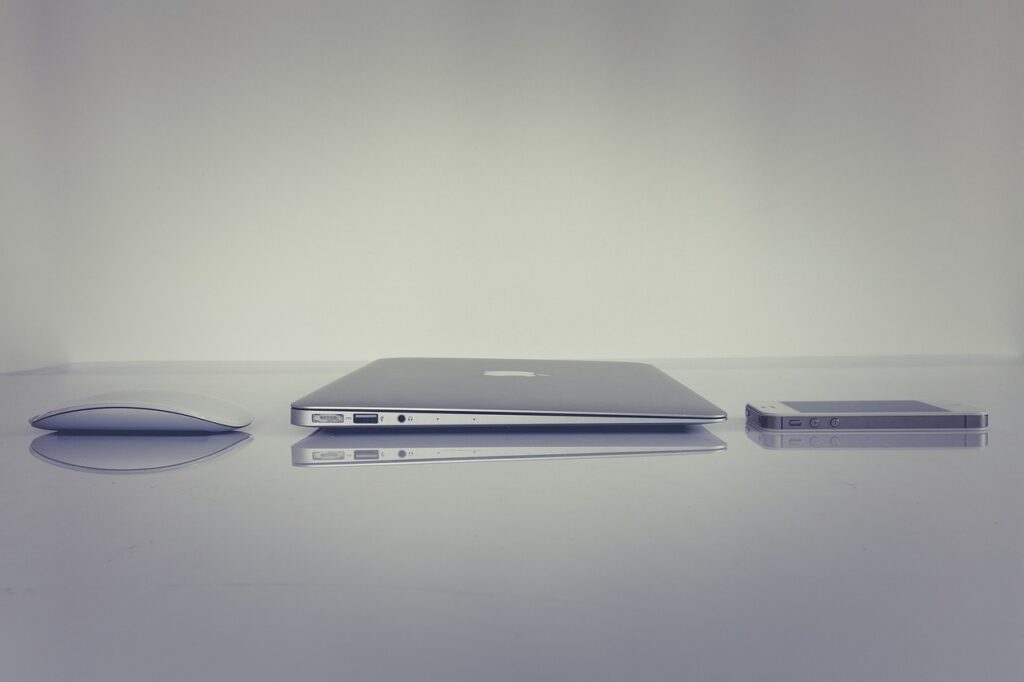 Minimalism, A laptop, mouse  and phone placed on a table